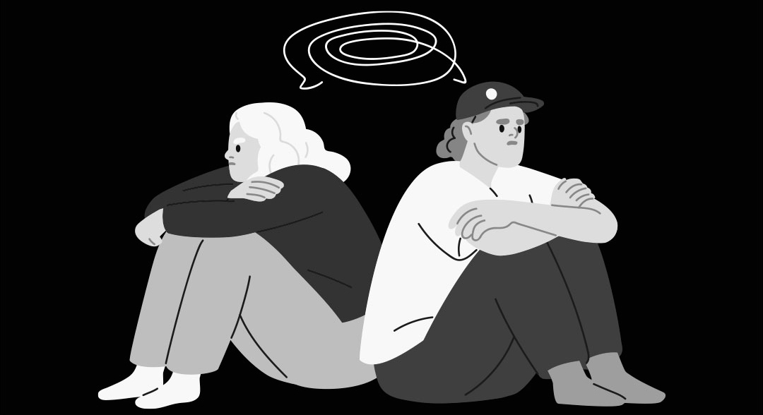 Dos personas en silencio, de espaldas, después de una discusión